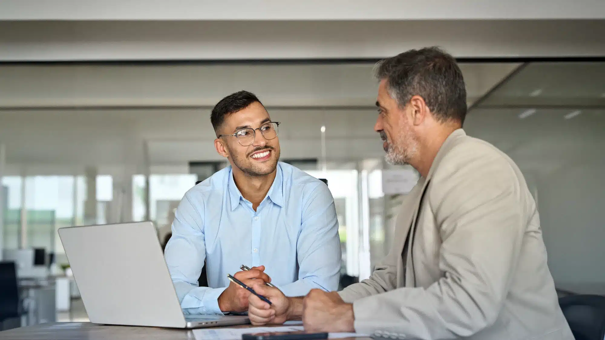 Florida business owner meeting with an employee benefits advisor to review health insurance and workplace benefits options