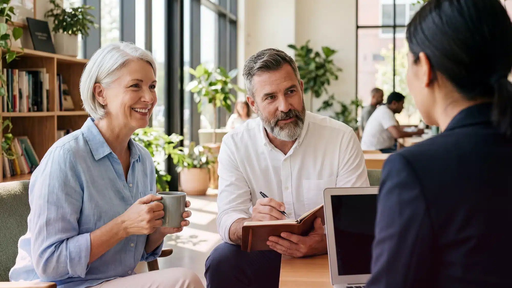 Financial advisor reviewing retirement planning options and investment strategies with client during consultation